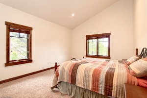 Cozy bedroom with colorful quilt