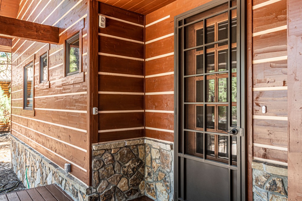 Rustic cabin exterior with wooden door