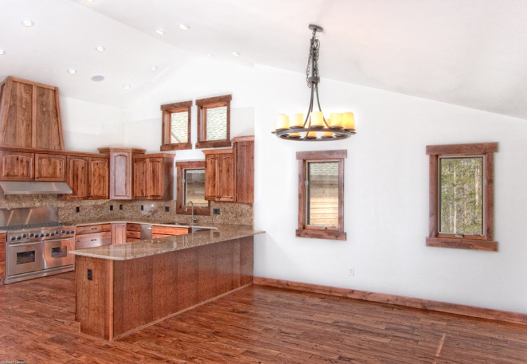 Spacious kitchen with wooden cabinets.