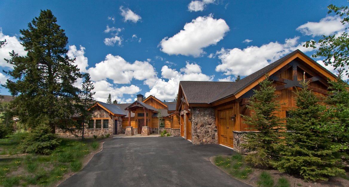 Rustic mountain cabin under blue sky