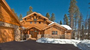 Snow-covered cabin in winter forest