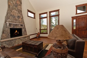 Cozy living room with stone fireplace.