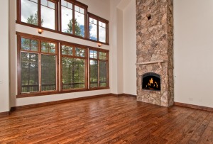 Spacious living room with stone fireplace