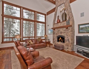 Cozy living room with large windows and fireplace