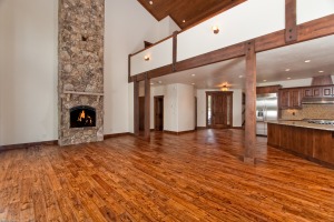 Spacious living room with stone fireplace