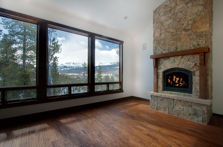 Cozy room with fireplace and large windows